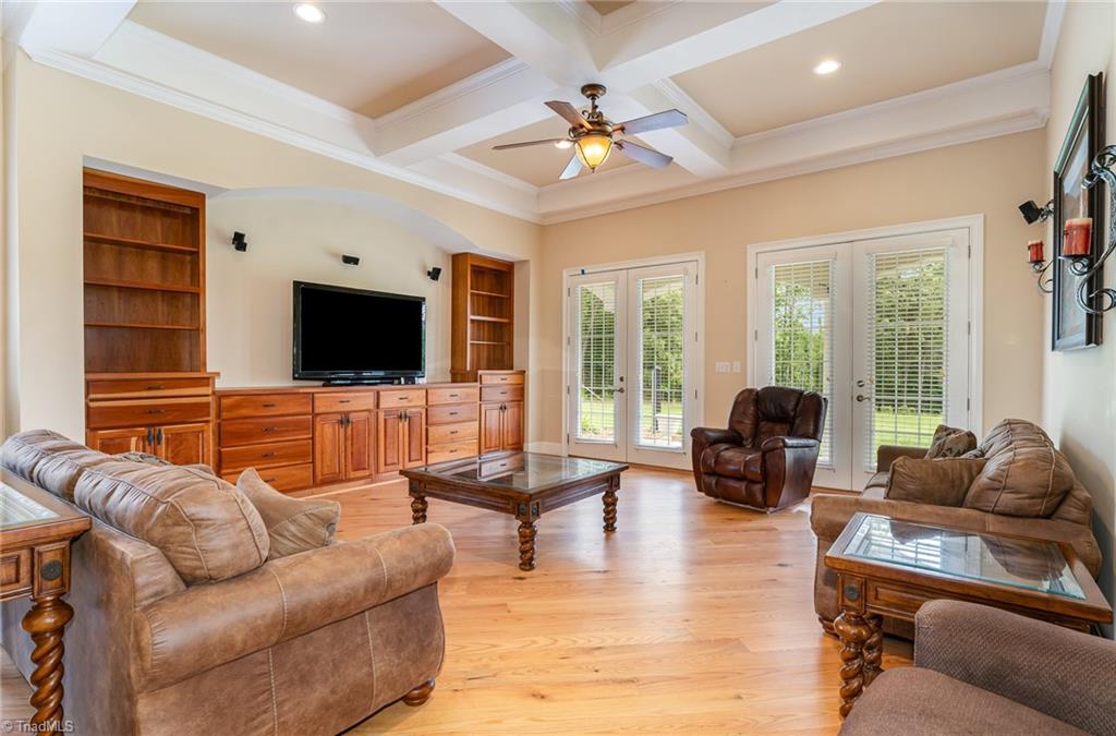 2250 Bethel Church Road Pleasant Garden, NC 27313 - Photo 6 of 45 Spacious family room ideal for large gatherings, with direct access to the veranda.