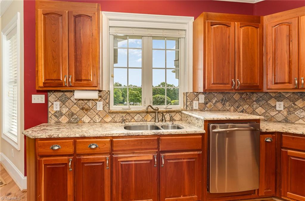 2250 Bethel Church Road Pleasant Garden, NC 27313 - Photo 9 of 45 Beautiful view from sink overlooking veranda, grassed pastures and barn.