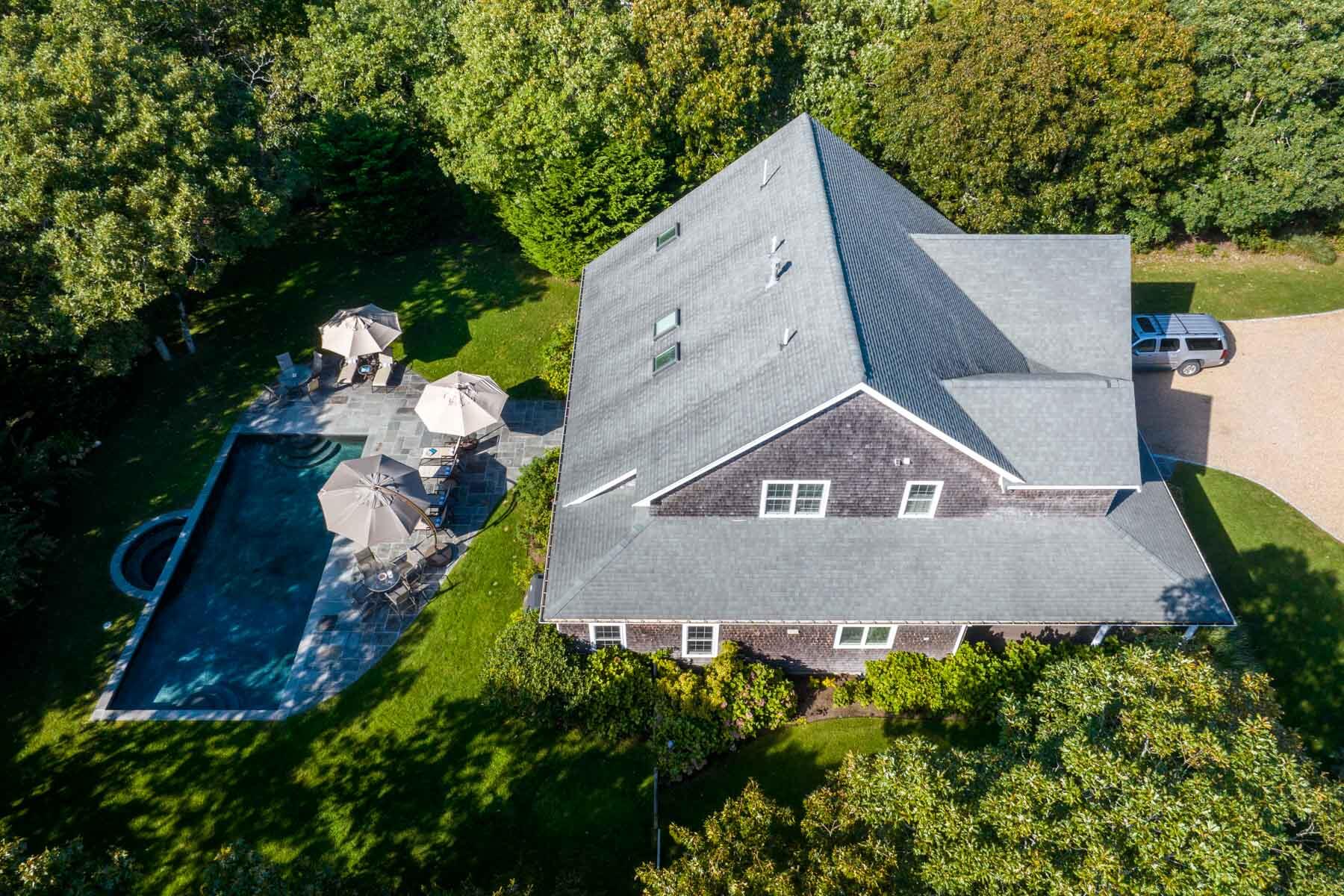 94 Marthas Road Edgartown, MA 02539 - Photo 29 of 36 an aerial view of a house with a yard and a large tree