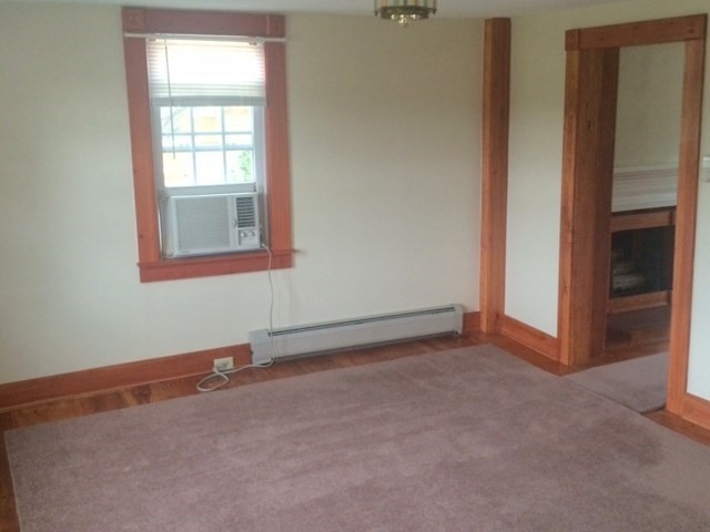 421 North East Street Amherst, MA 01002 - Photo 4 of 7 an empty room with windows