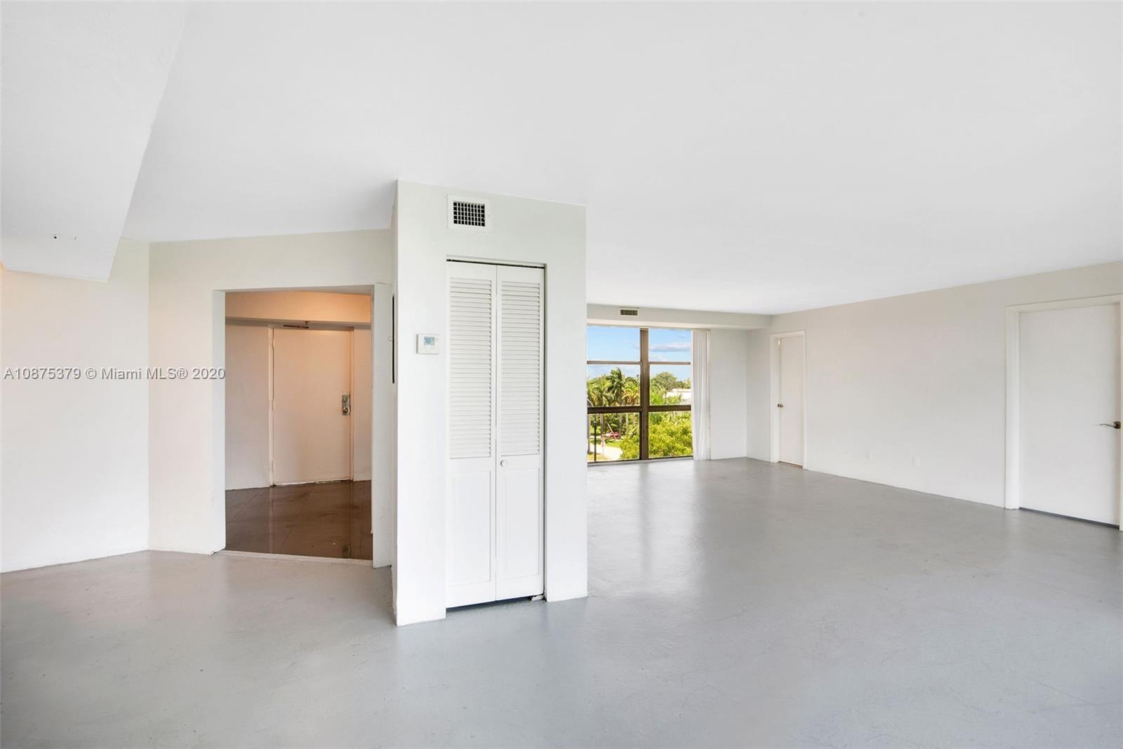 Morningside Miami, FL 33137 - Photo 13 of 27 an empty room with a natural light