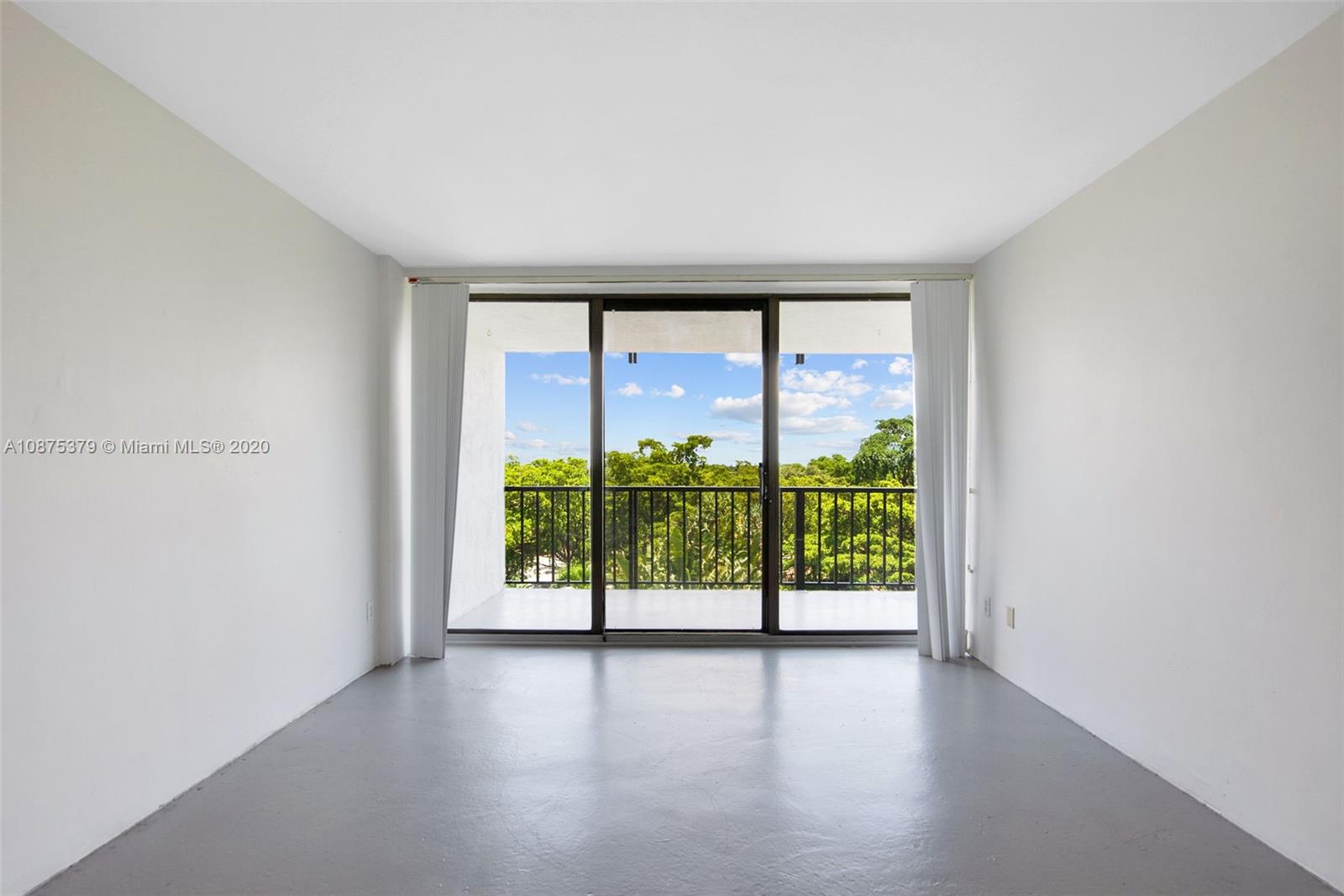 Morningside Miami, FL 33137 - Photo 17 of 27 an empty room with large windows