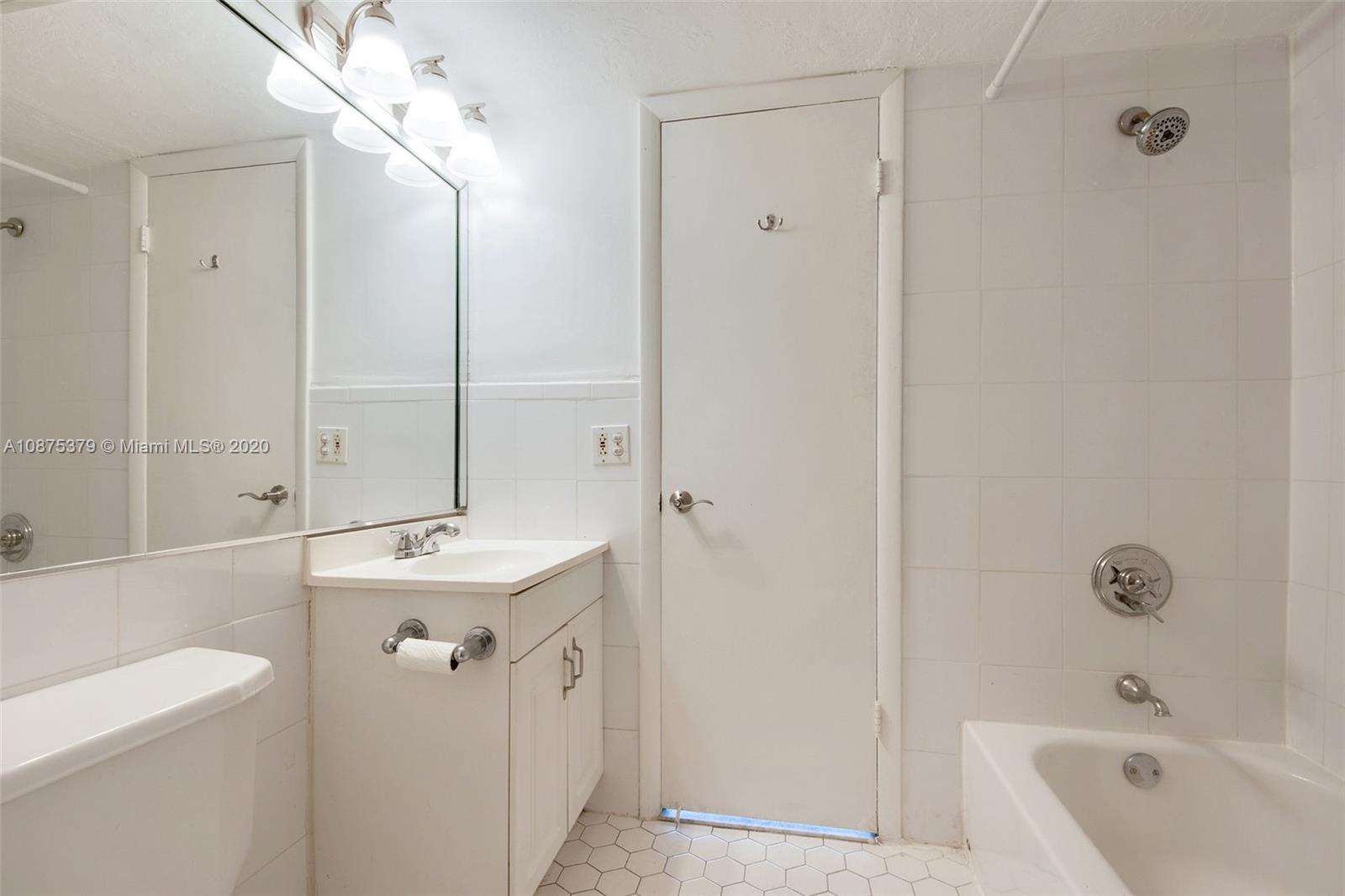 Morningside Miami, FL 33137 - Photo 22 of 27 a bathroom with a sink a toilet and shower