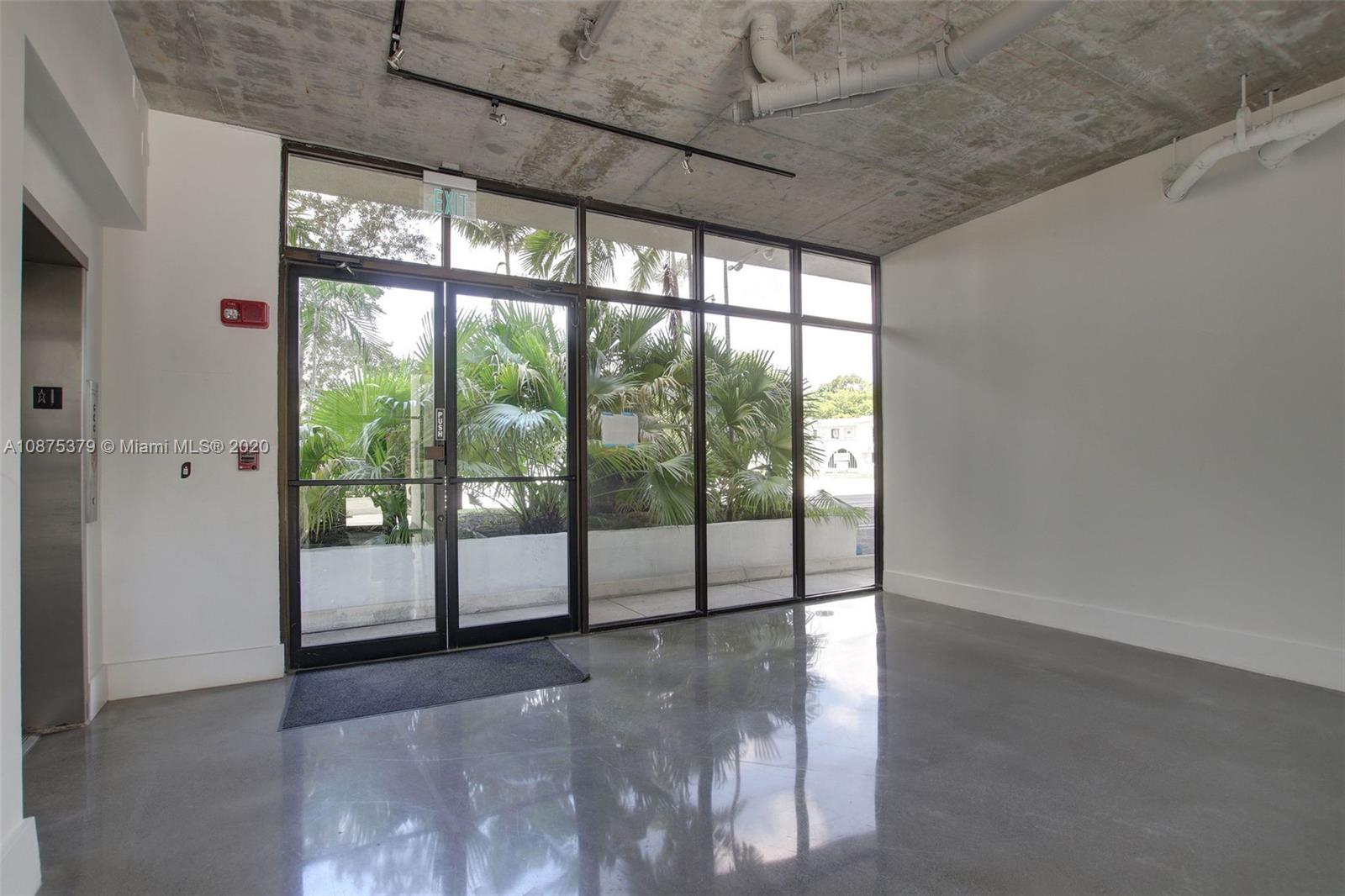 Morningside Miami, FL 33137 - Photo 27 of 27 a view of an empty room with wooden floor and windows