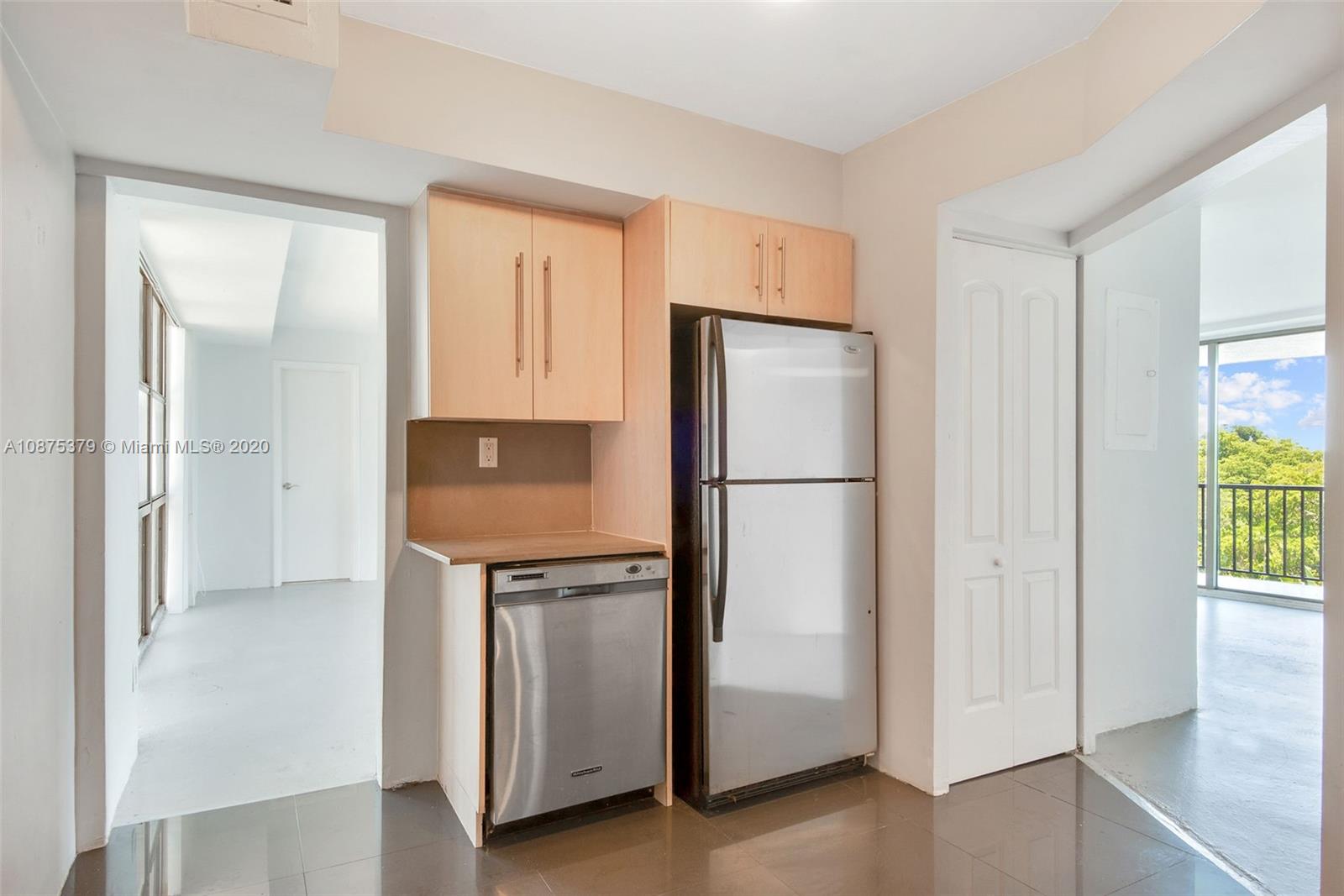 Morningside Miami, FL 33137 - Photo 4 of 27 a kitchen with stainless steel appliances a refrigerator and a sink