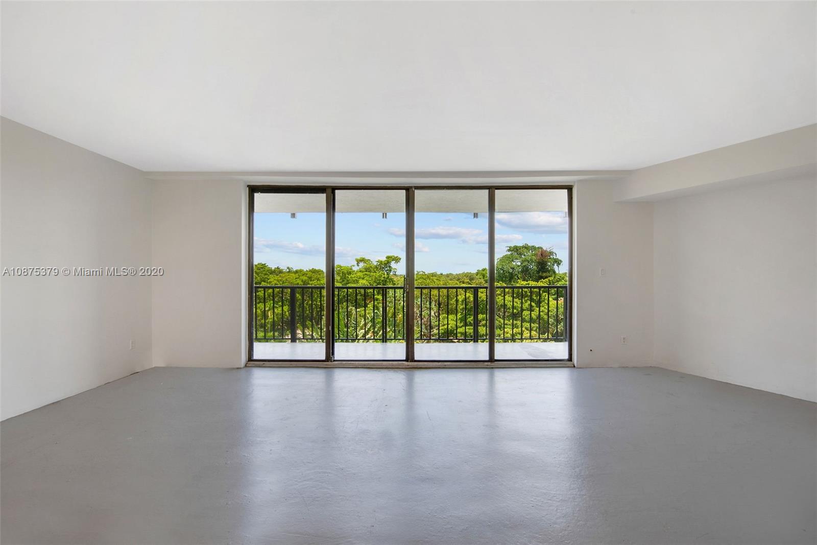 Morningside Miami, FL 33137 - Photo 7 of 27 wooden floor in an empty room with a window