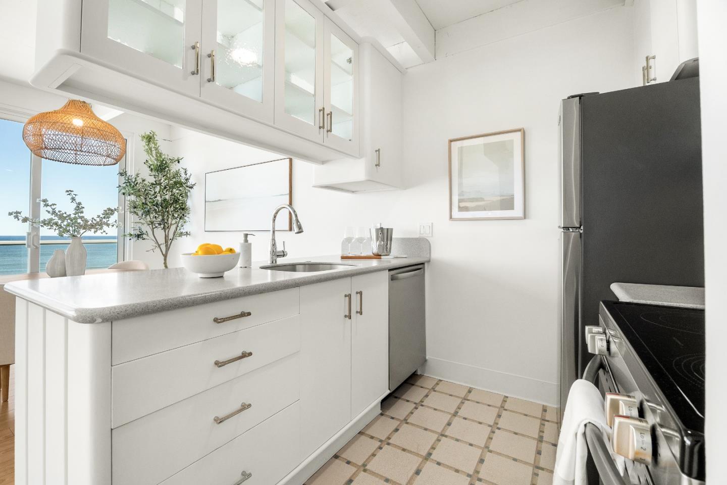 230 Rio Del Mar Boulevard, Unit K Aptos, CA 95003 - Photo 12 of 29 a kitchen with stainless steel appliances a sink stove and refrigerator
