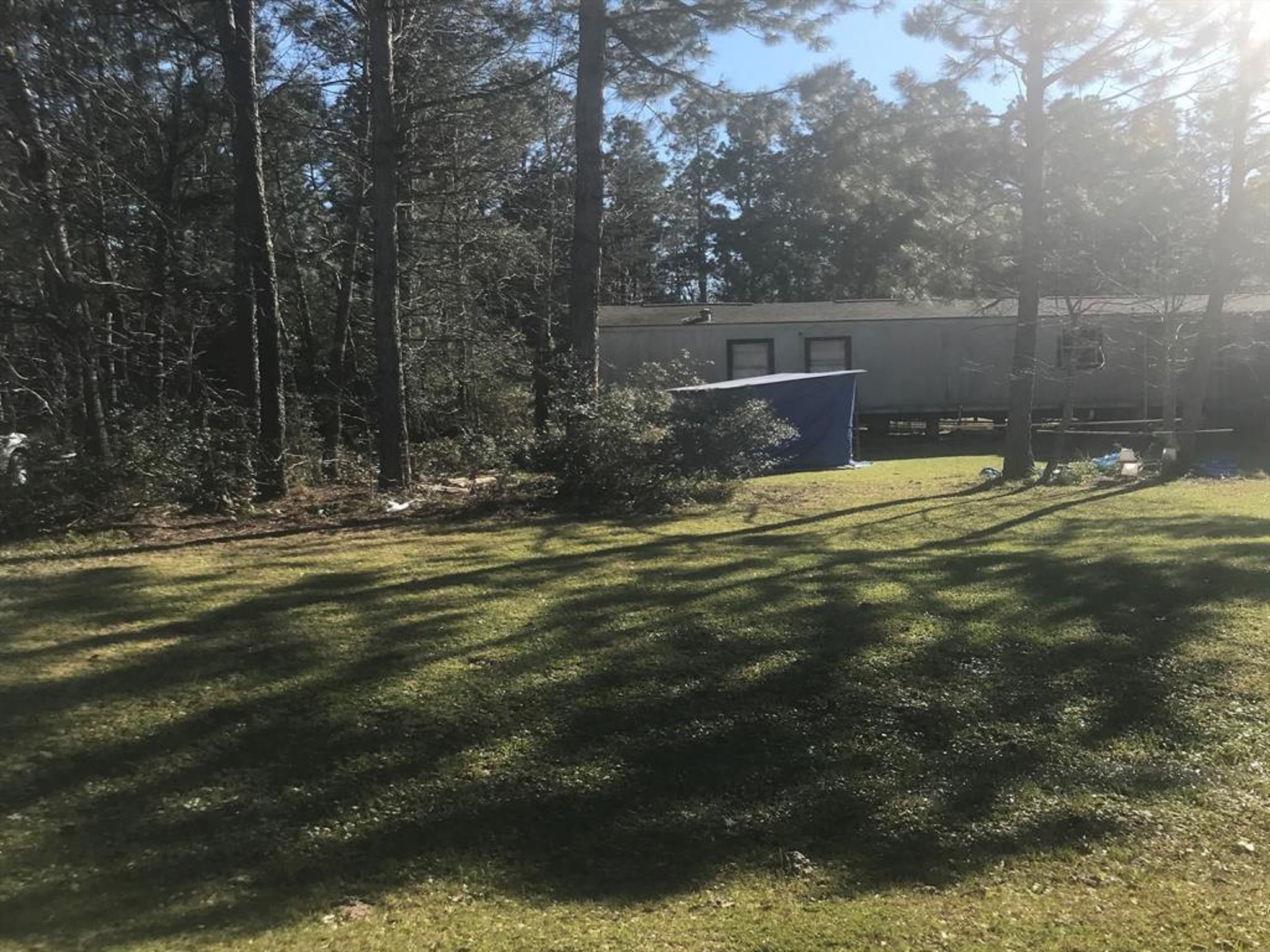 19282 Amy Lane Porter, TX 77365 - Photo 9 of 11 a backyard of a house with lots of green space and fountain