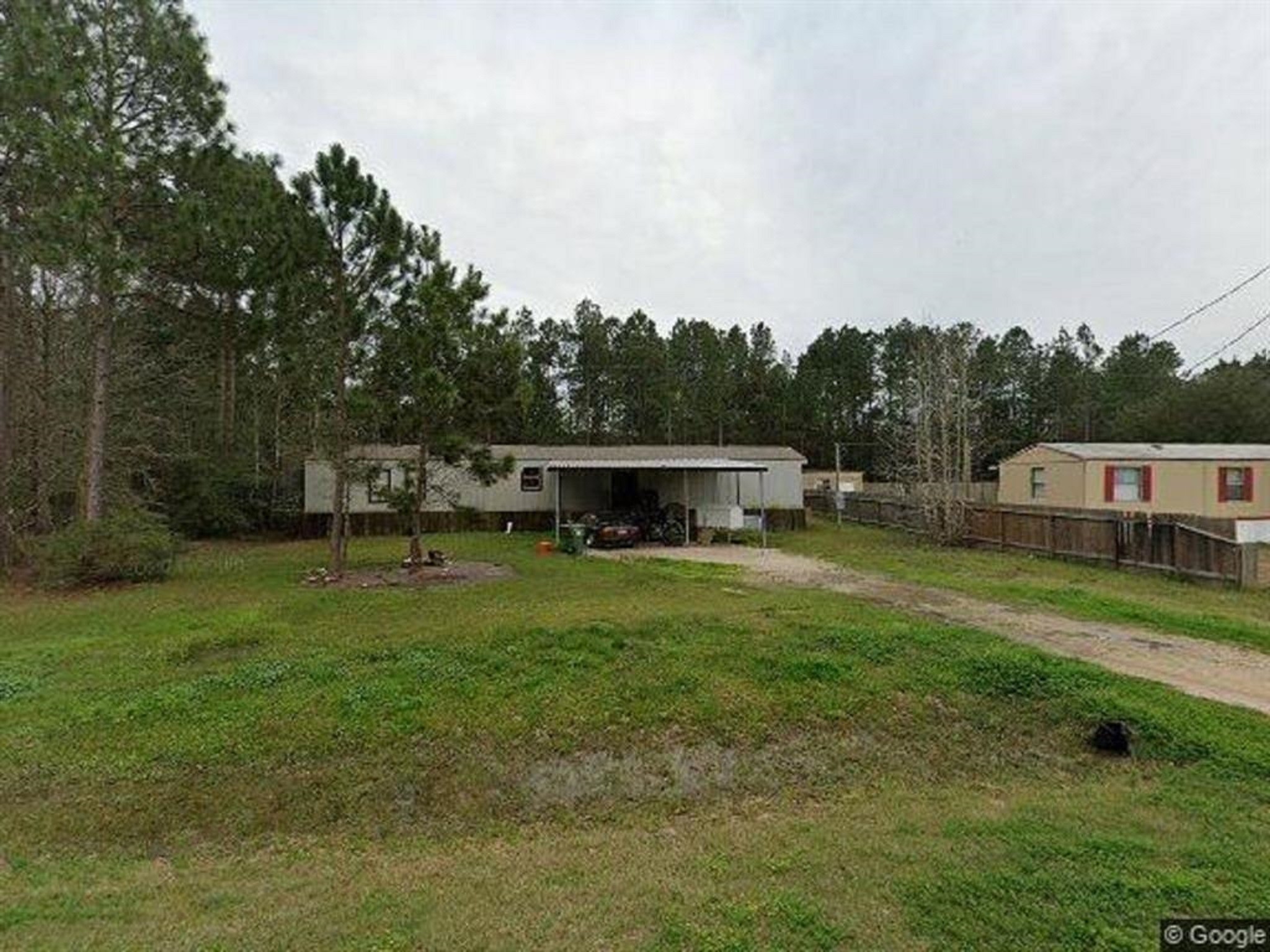 19282 Amy Lane Porter, TX 77365 - Photo 10 of 11 a front view of a house with garden