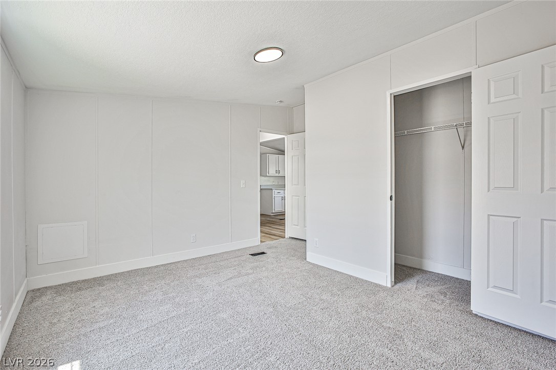 273 Aztec Lane Henderson, NV 89015 - Photo 21 of 28 A spacious, naturally illuminated room featuring plush carpeting and a large, accessible closet.