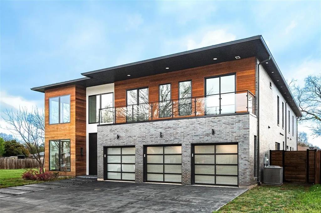 309 Kaye Street Coppell, TX 75019 - Photo 4 of 36 Modern multi-level exterior with wood paneling and grey brick accents