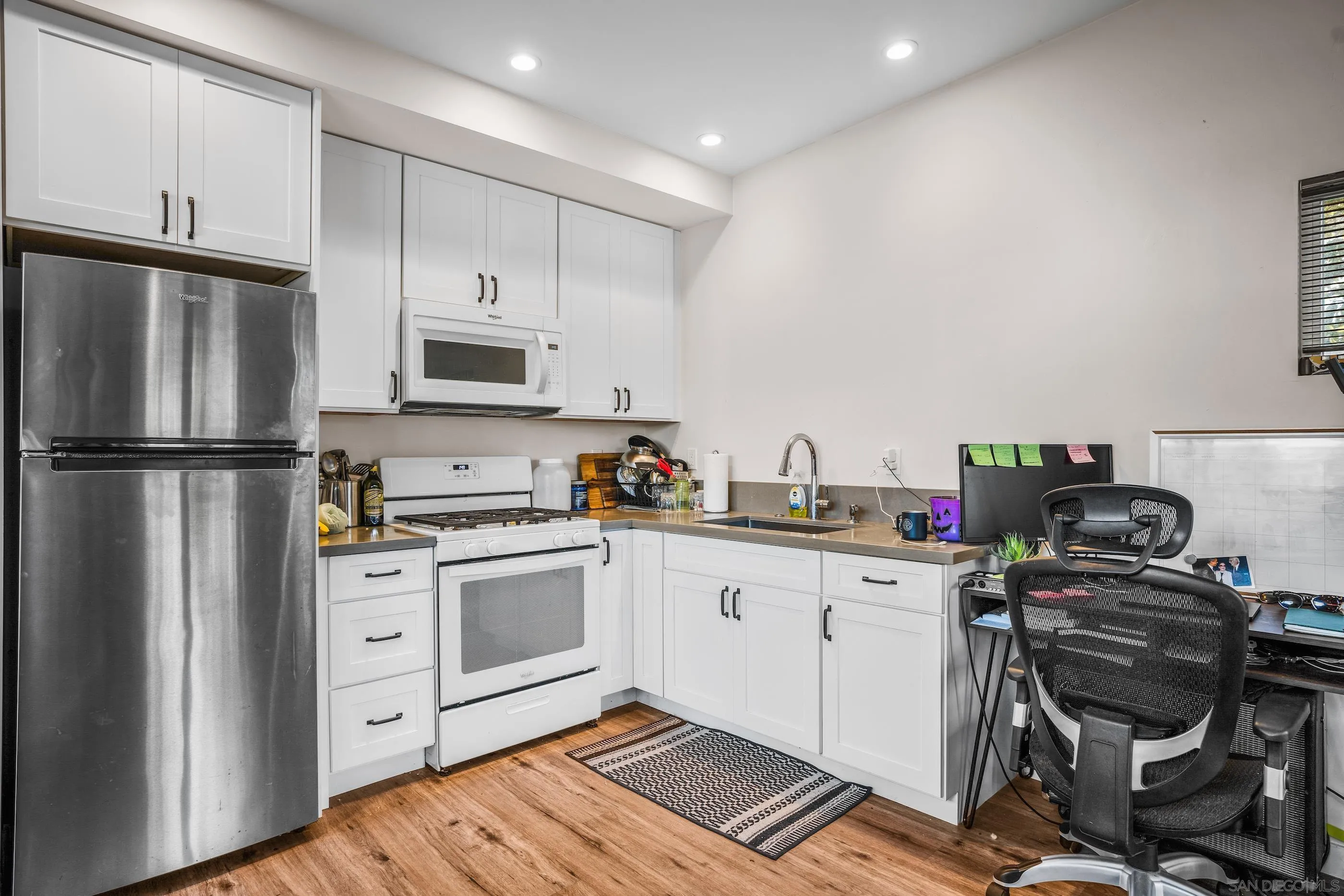 1530 Vanessa Circle Encinitas, CA 92024 - Photo 32 of 45 a kitchen with granite countertop a refrigerator stove and sink