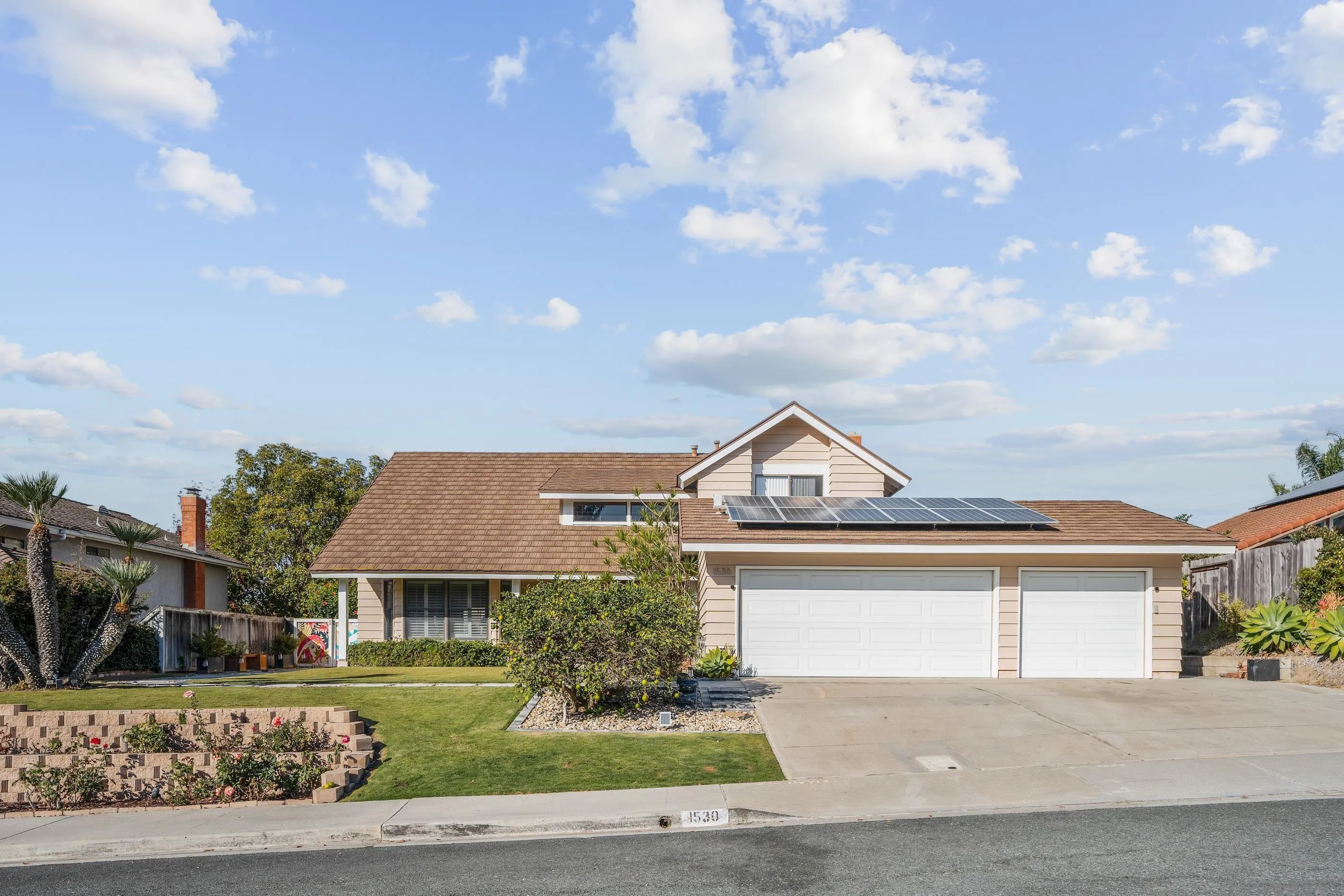 1530 Vanessa Circle Encinitas, CA 92024 - Photo 44 of 45 a front view of a house with a garden