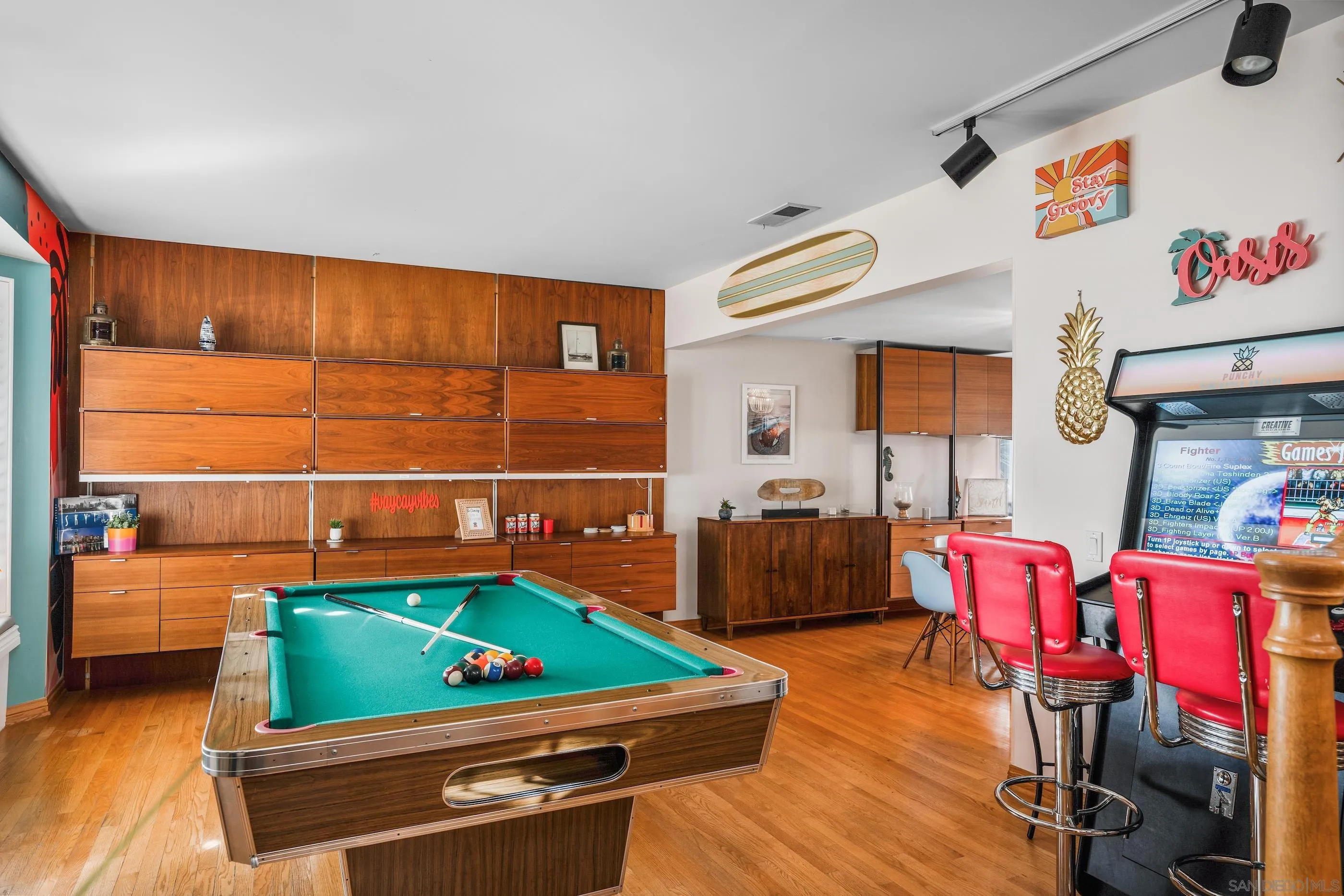 1530 Vanessa Circle Encinitas, CA 92024 - Photo 8 of 45 a room with furniture and a flat screen tv