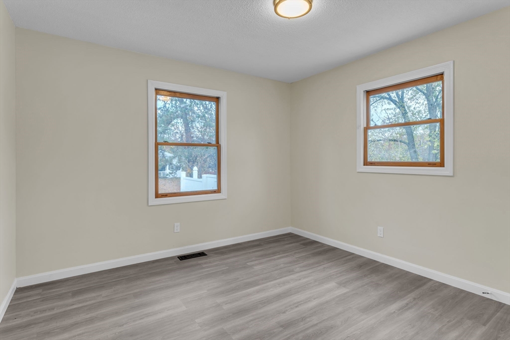 115 Carroll Street Springfield, MA 01108 - Photo 14 of 25 an empty room with a window