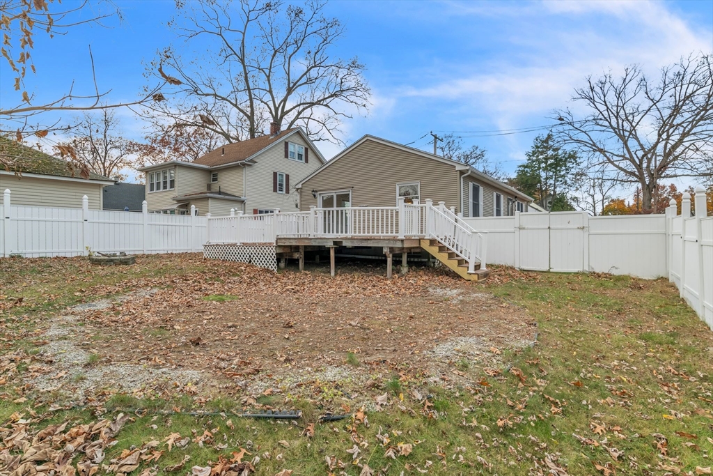 115 Carroll Street Springfield, MA 01108 - Photo 24 of 25 a front view of a house with a yard and garage