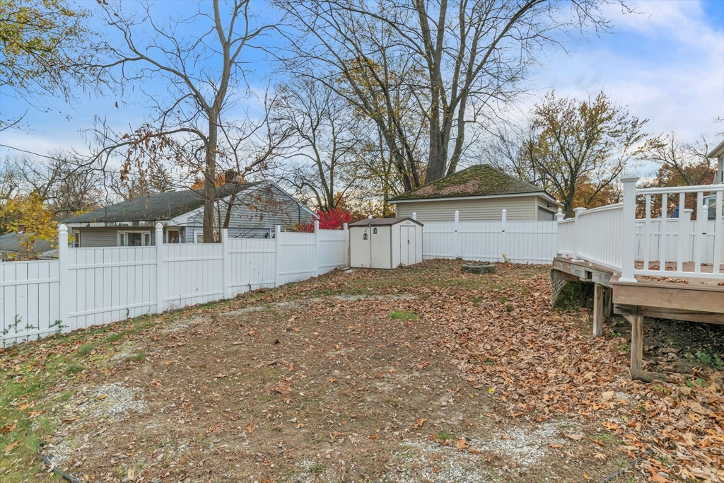 115 Carroll Street Springfield, MA 01108 - Photo 25 of 25 a backyard of a house with table and chairs