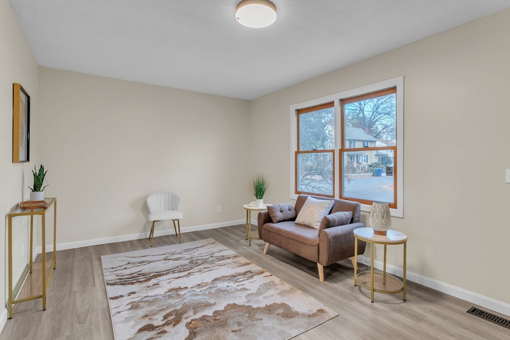 115 Carroll Street Springfield, MA 01108 - Photo 4 of 25 a living room with furniture and a window