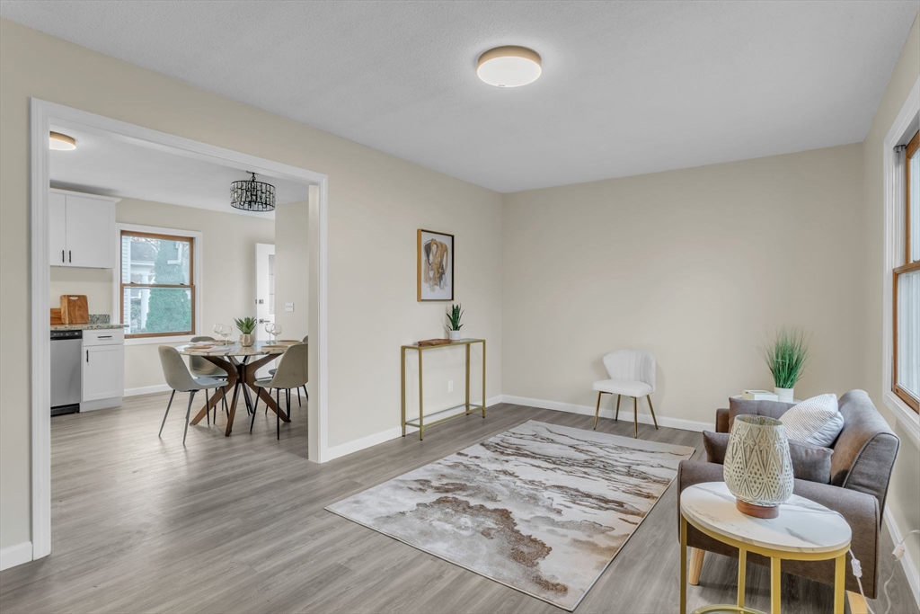 115 Carroll Street Springfield, MA 01108 - Photo 5 of 25 a living room with furniture and wooden floor