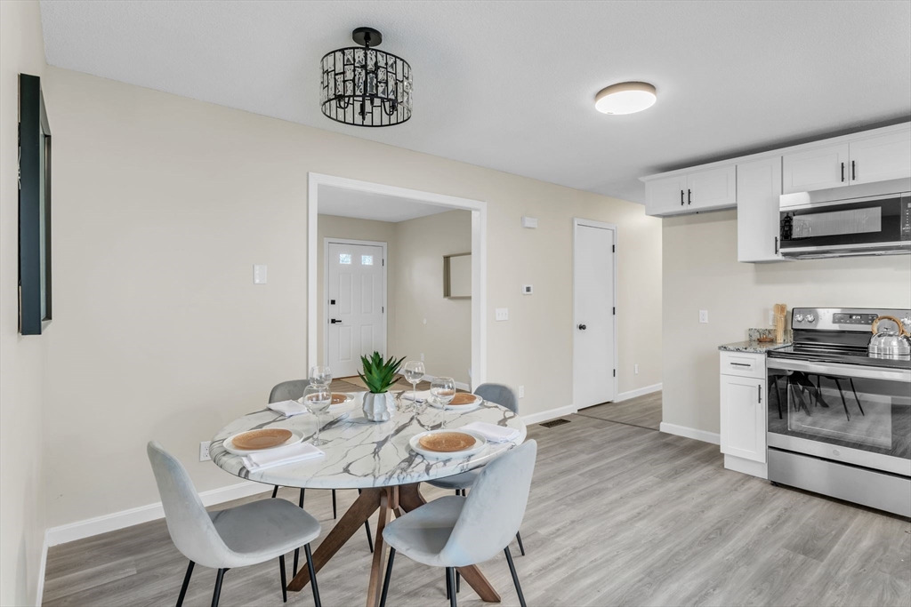 115 Carroll Street Springfield, MA 01108 - Photo 7 of 25 a view of a dining room with furniture