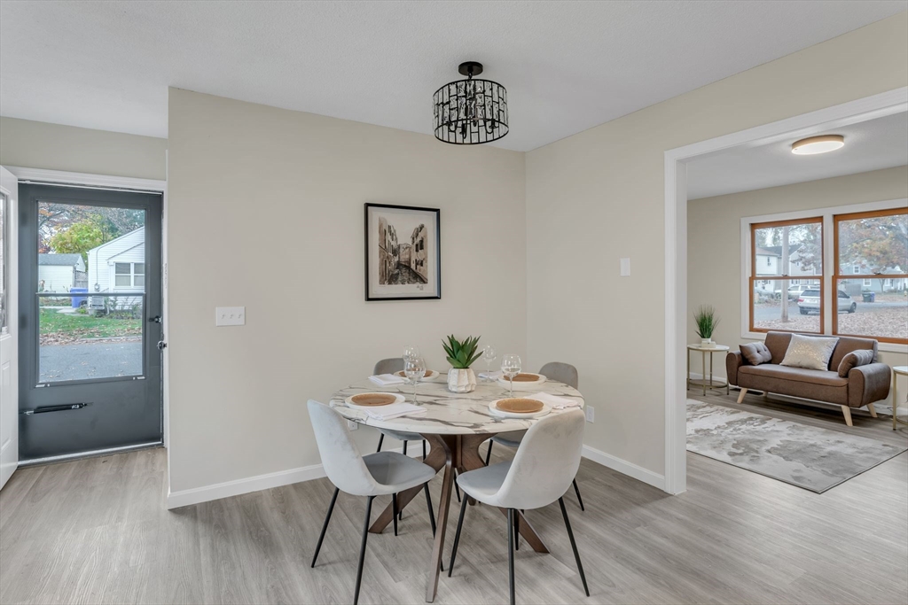 115 Carroll Street Springfield, MA 01108 - Photo 8 of 25 a view of a dining room with furniture window and wooden floor