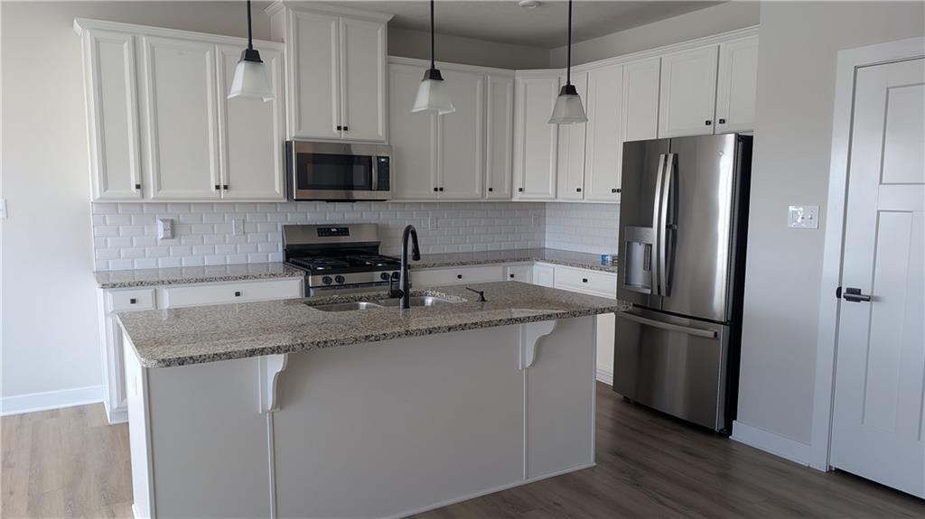 170 High Pointe Drive Washington, PA 15301 - Photo 4 of 29 a kitchen with stainless steel appliances granite countertop a refrigerator a sink and white cabinets