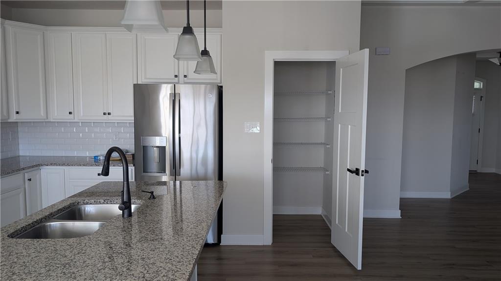 170 High Pointe Drive Washington, PA 15301 - Photo 7 of 29 a kitchen with a refrigerator a sink and cabinets