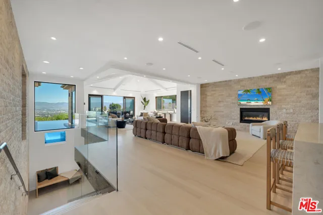 a bedroom with a large bed and a large window