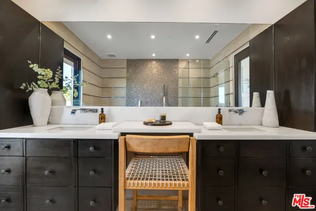 a bedroom with a bed and a chair