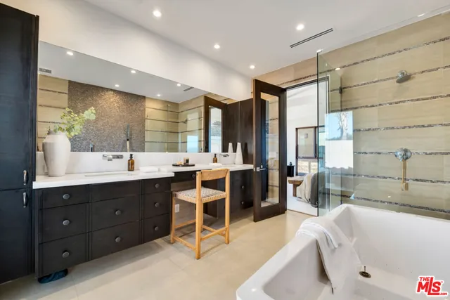 a bedroom with furniture and a potted plant