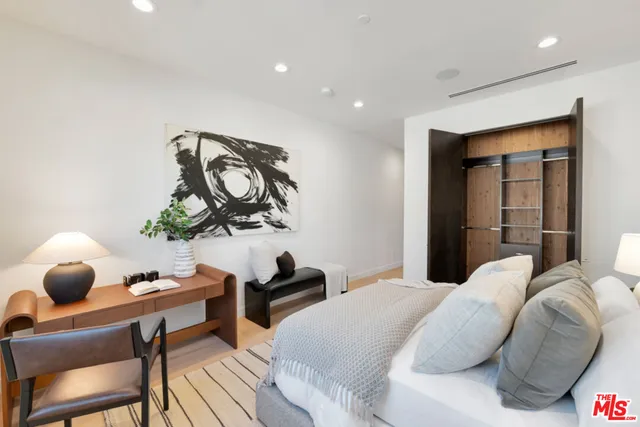 a bathroom with a granite countertop sink a mirror and shower