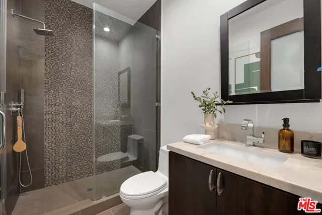 a living room with furniture potted plant and a window