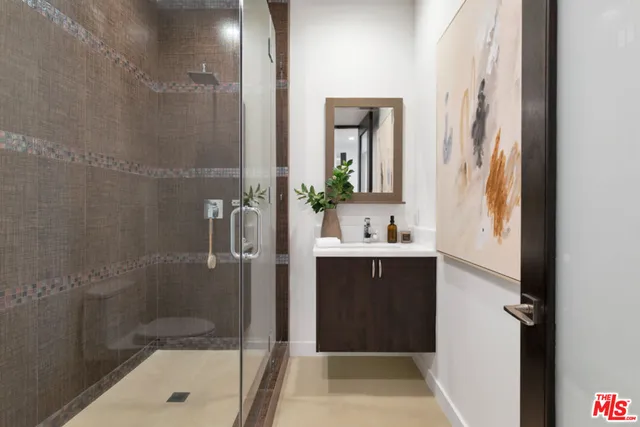 a living room with couches and a flat screen tv