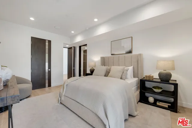 a dining room with furniture and a wooden floor