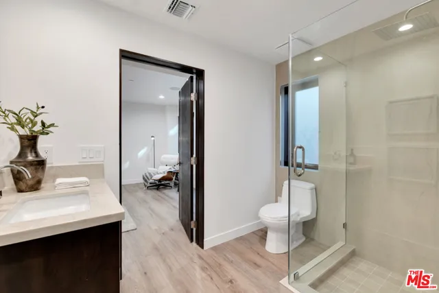 a front view of a house with wooden fence