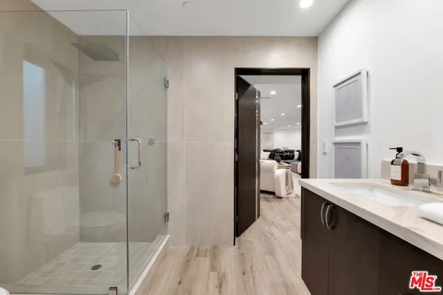 a view of a patio with table and chairs with wooden floor and fence