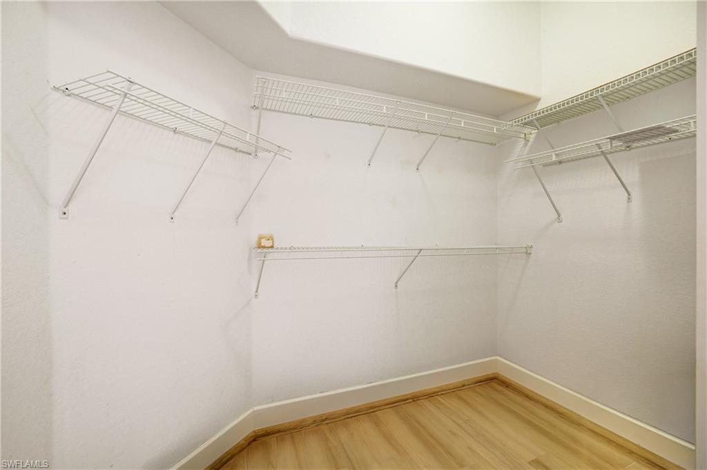 5235 Malvern Court Naples, FL 34112 - Photo 18 of 28 a view of a room with racks on the wall