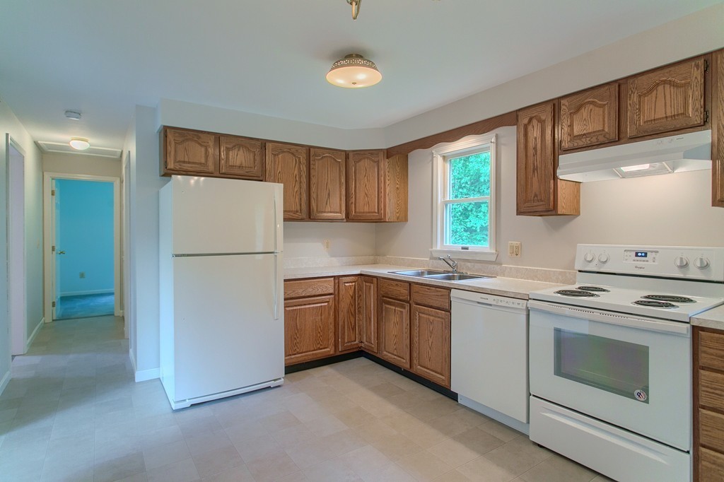 16 Clement Road Townsend, MA 01474 - Photo 3 of 19 a kitchen with cabinets appliances and a window