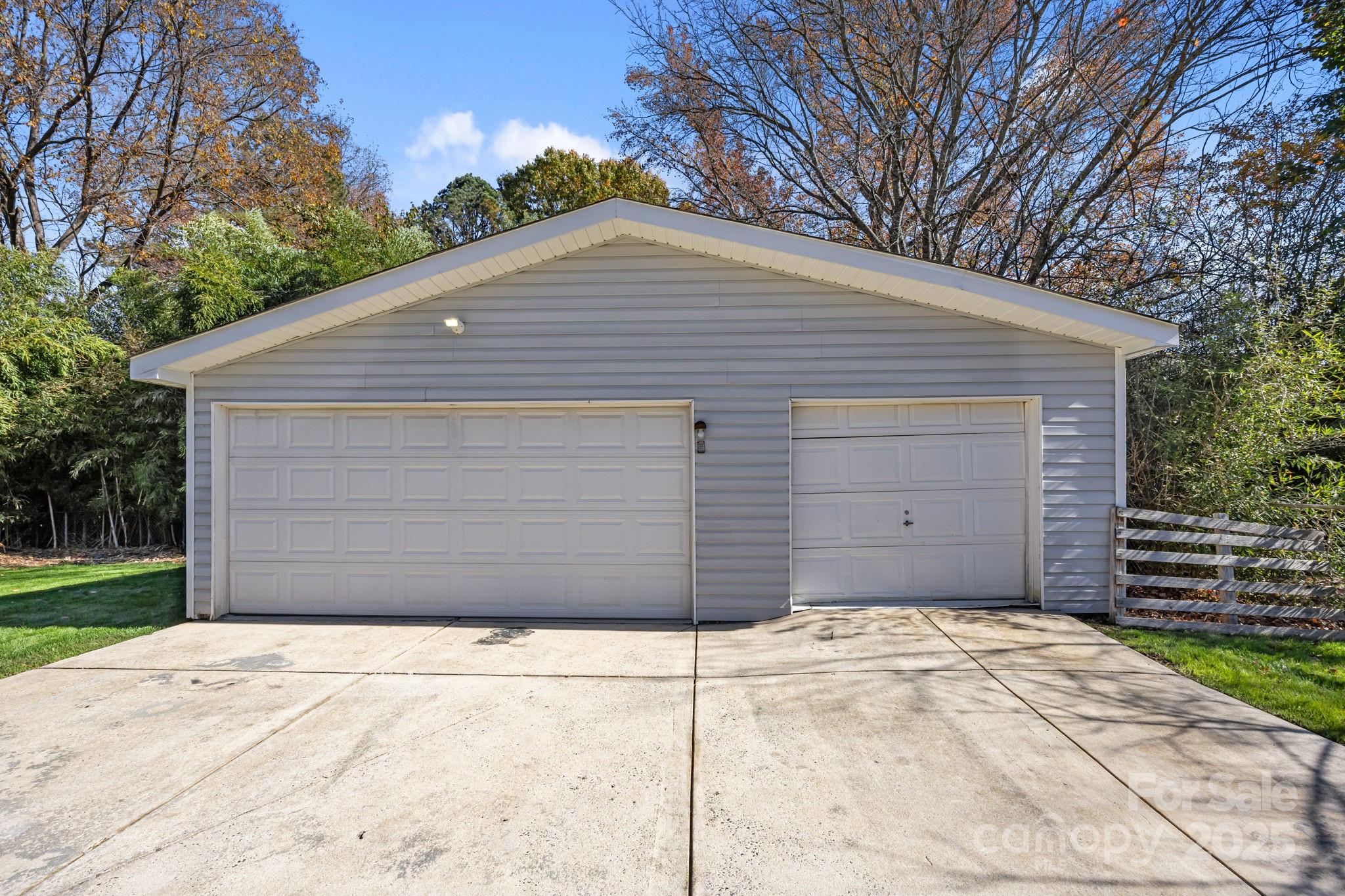 3512 Cross Winds Road Charlotte, NC 28227 - Photo 28 of 32 a view of a small house with a garage