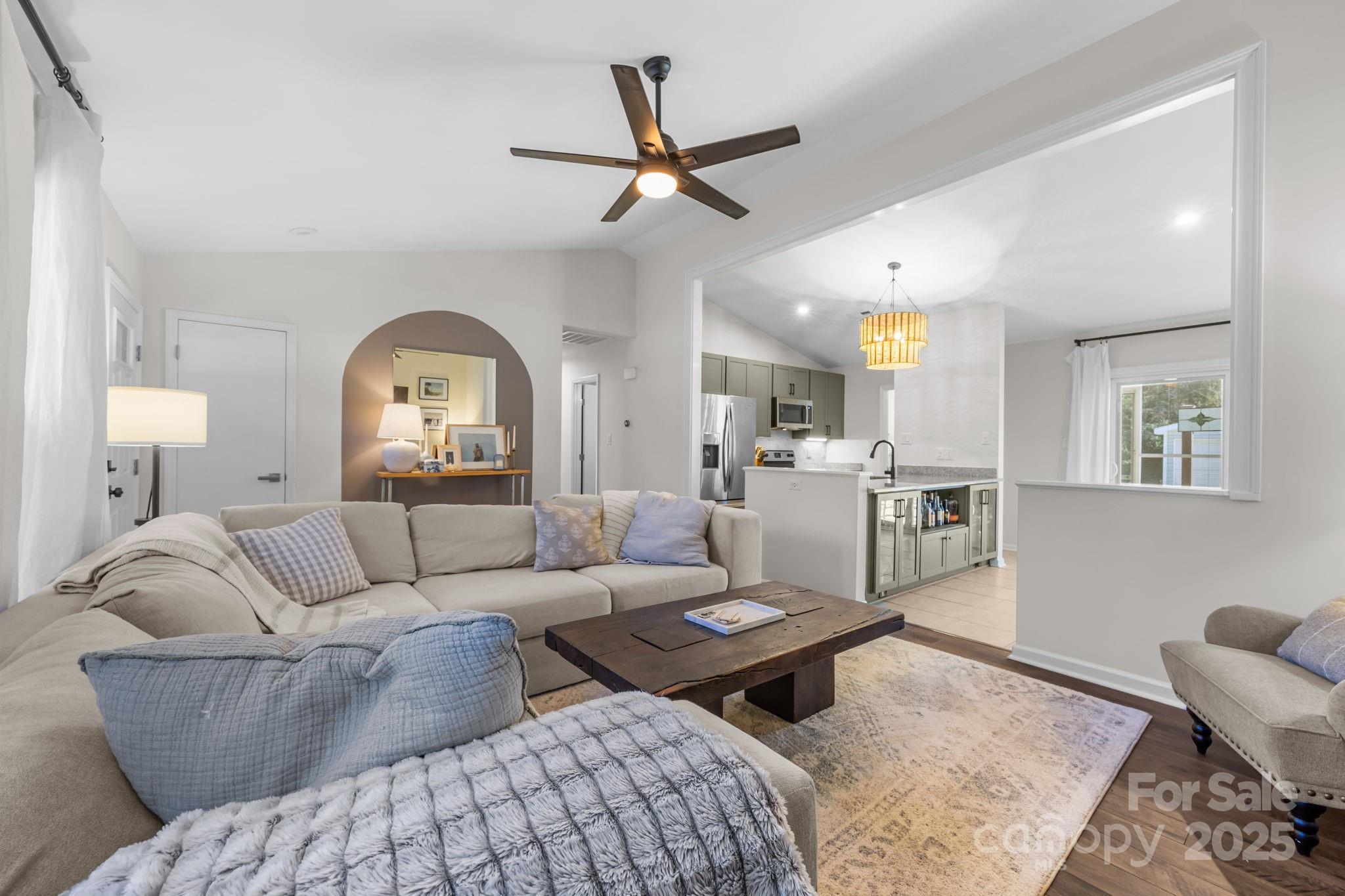 3512 Cross Winds Road Charlotte, NC 28227 - Photo 5 of 32 a living room with furniture and a wooden floor