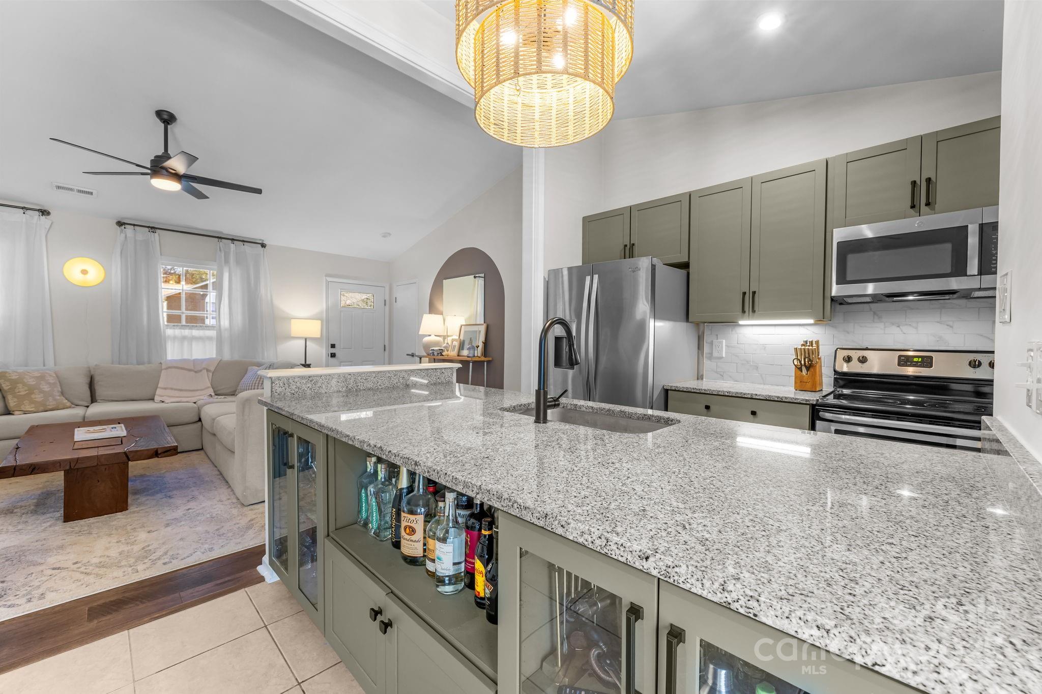 3512 Cross Winds Road Charlotte, NC 28227 - Photo 6 of 32 a kitchen with stainless steel appliances granite countertop a stove a refrigerator and a sink