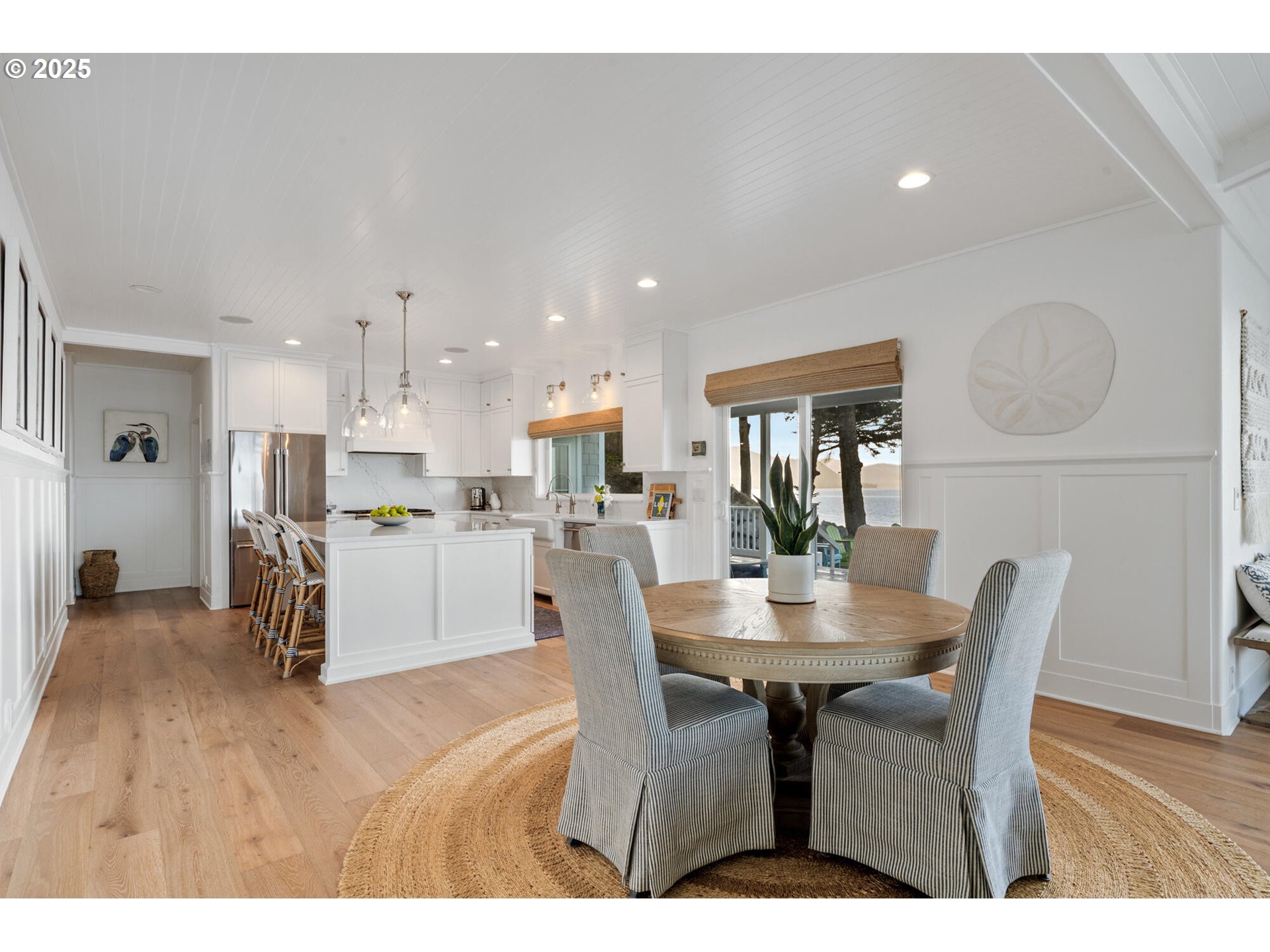 3375 Netarts Bay Drive Netarts, OR 97141 - Photo 12 of 48 a view of a dining room with furniture and wooden floor