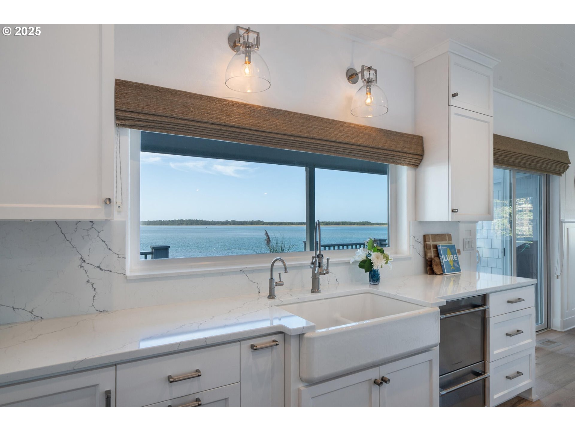 3375 Netarts Bay Drive Netarts, OR 97141 - Photo 17 of 48 a kitchen with a sink cabinets and a window