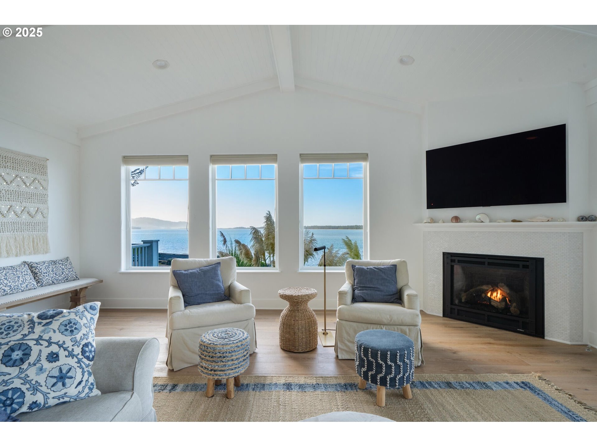 3375 Netarts Bay Drive Netarts, OR 97141 - Photo 2 of 48 a living room with furniture a fireplace and a flat screen tv