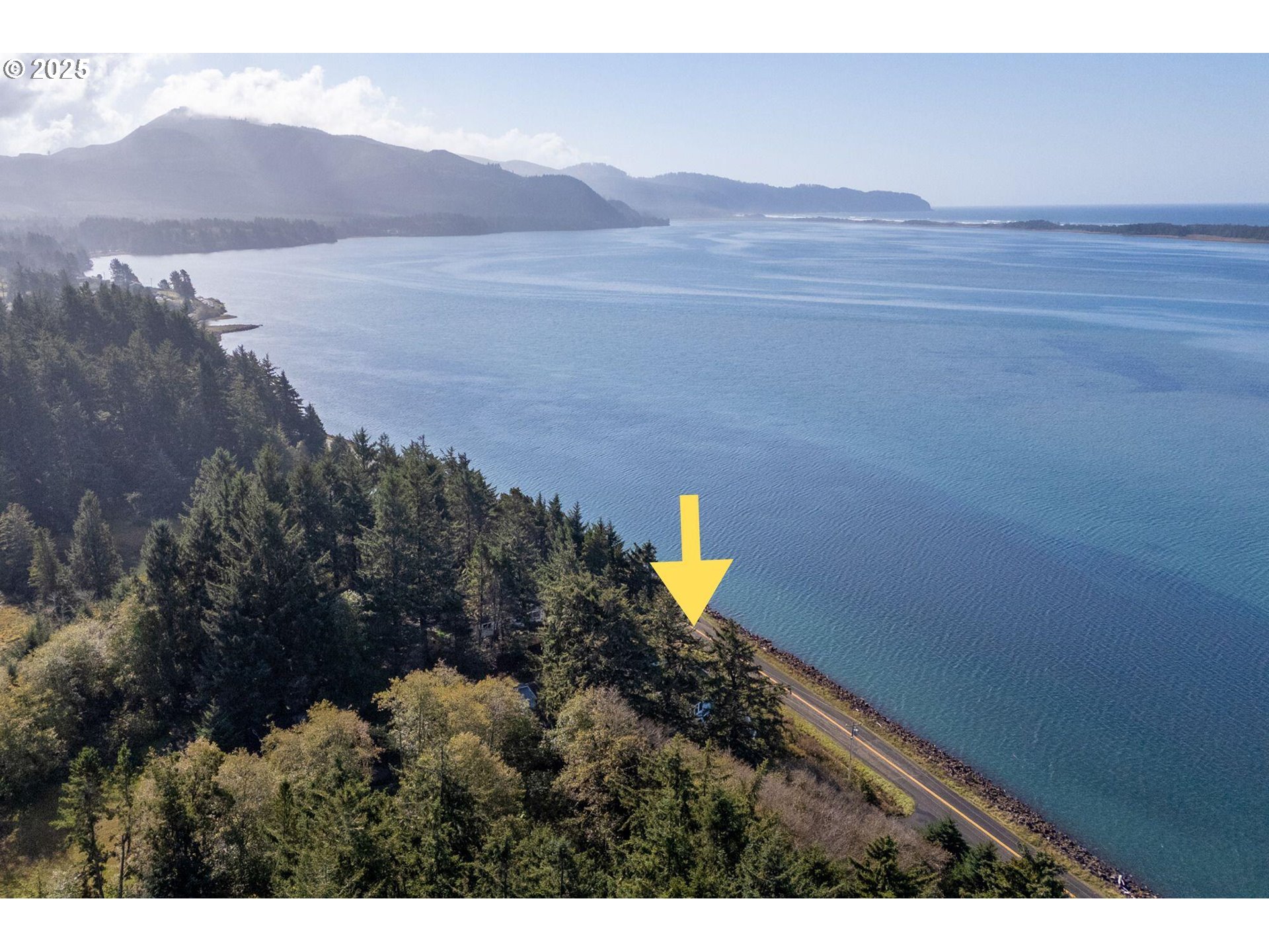 3375 Netarts Bay Drive Netarts, OR 97141 - Photo 24 of 48 a view of a lake and a mountain