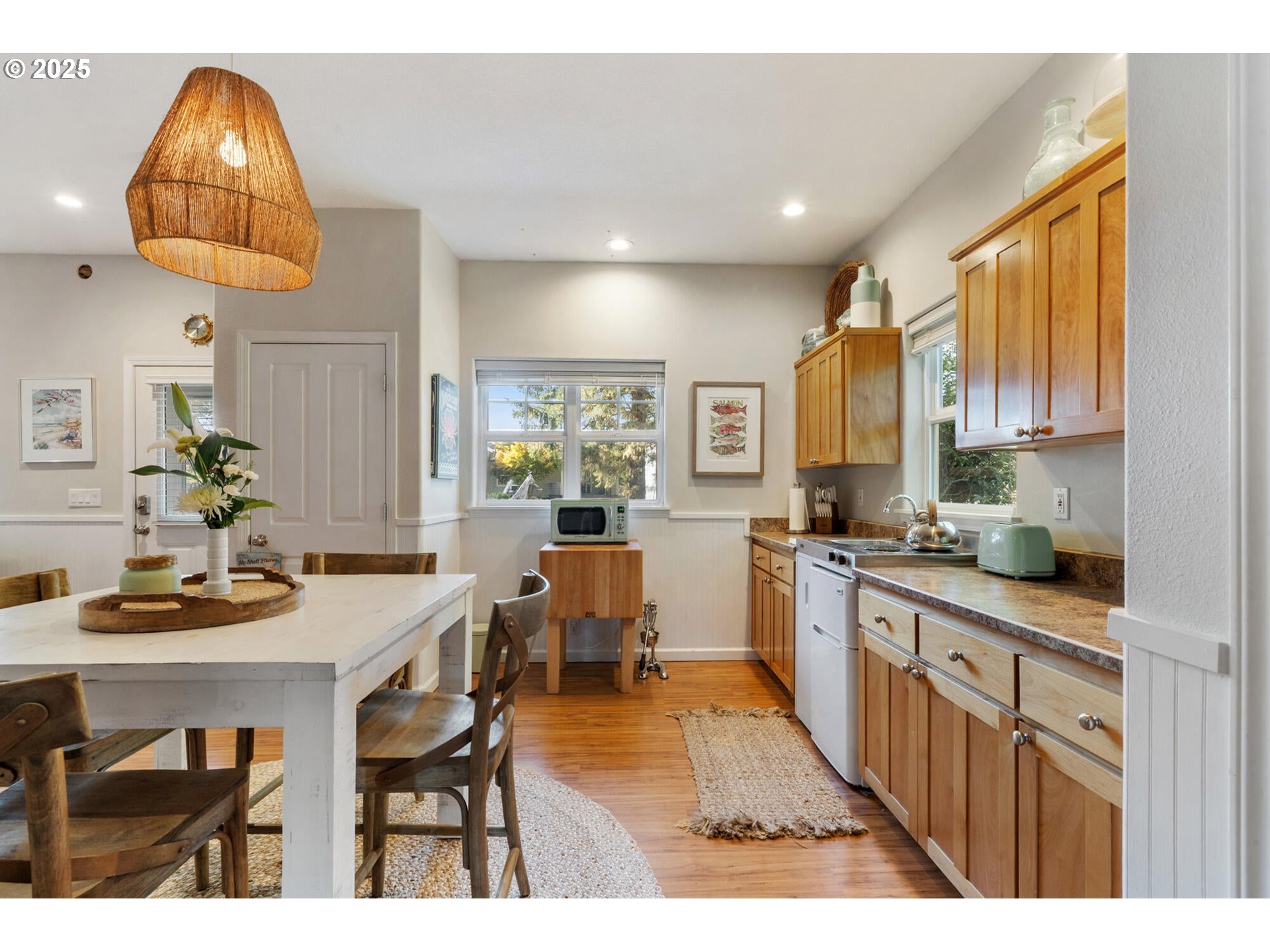 3375 Netarts Bay Drive Netarts, OR 97141 - Photo 43 of 48 a kitchen with stainless steel appliances a sink a stove a table and chairs