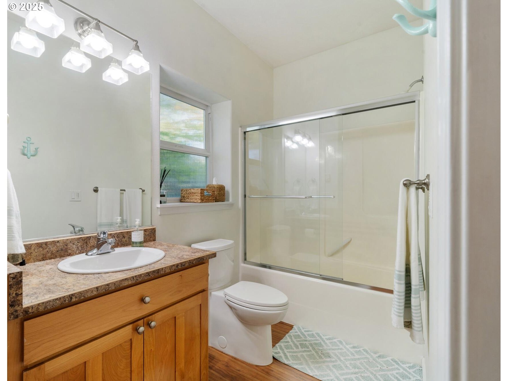 3375 Netarts Bay Drive Netarts, OR 97141 - Photo 45 of 48 a bathroom with a shower sink vanity mirror and toilet