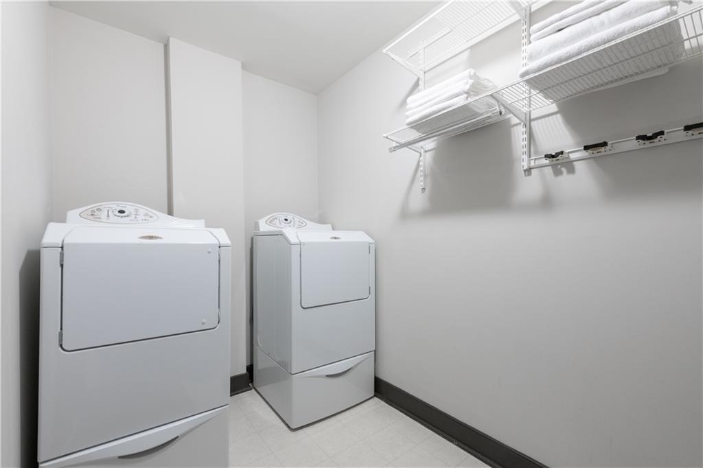 201 West Ponce De Leon Avenue, Unit 502 Decatur, GA 30030 - Photo 25 of 49 a utility room with dryer and washer