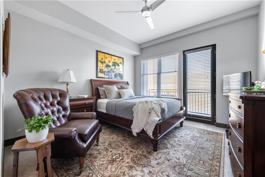 201 West Ponce De Leon Avenue, Unit 502 Decatur, GA 30030 - Photo 29 of 49 a bed room with a bed and a couch