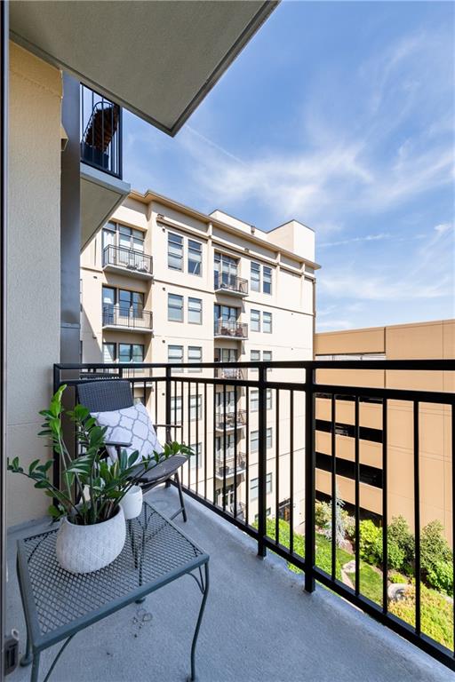 201 West Ponce De Leon Avenue, Unit 502 Decatur, GA 30030 - Photo 31 of 49 a view of a balcony with chair and potted plants